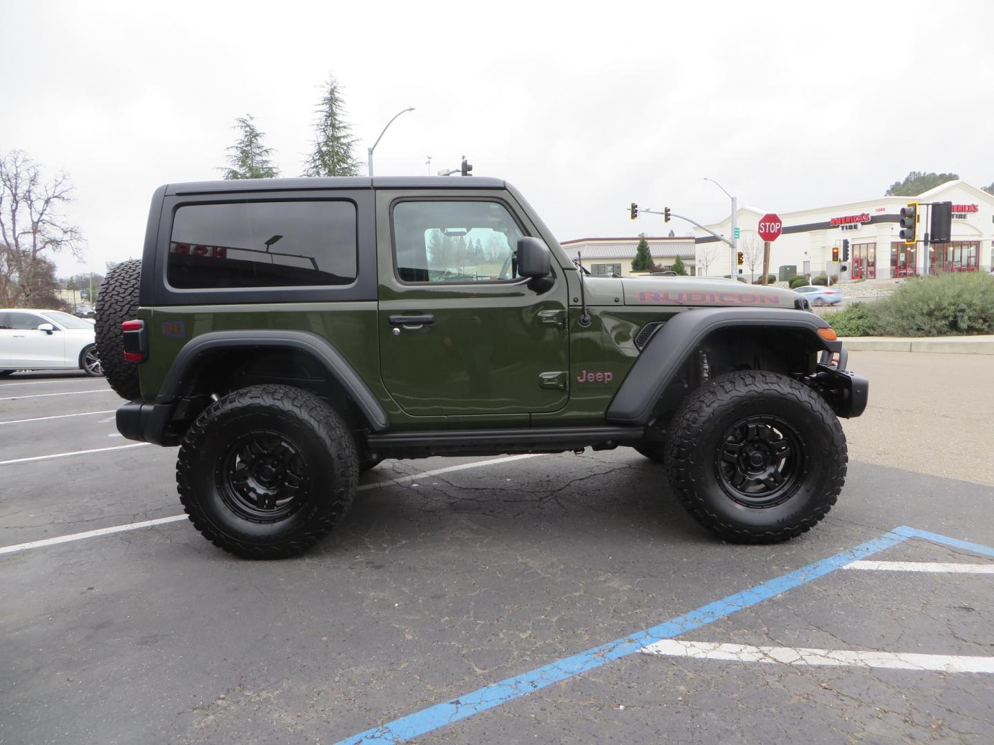 2021 Sarge Green /BLACK Jeep Wrangler Rubicon (1C4HJXCN4MW) with an 2.0L L4 DOHC 16V TURBO engine, 6A transmission, located at 2630 Grass Valley Highway, Auburn, CA, 95603, (530) 508-5100, 38.937893, -121.095482 - Rubicon featuring a Mopar suspension system, Fox shocks, 17" Fuel Wheels, BFG KO2 tires, Maxximus 3 front bumper stinger, Dual exhaust, Bolt hitch lock, Mopar HD tailgate hinge, and a custom cargo platform. - Photo#3